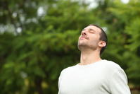 man breathing outdoors