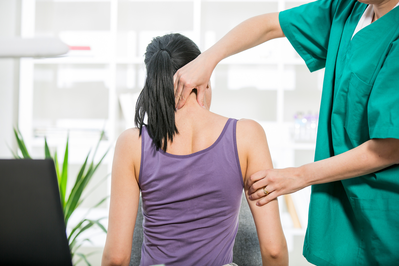 chiropractor adjusting neck